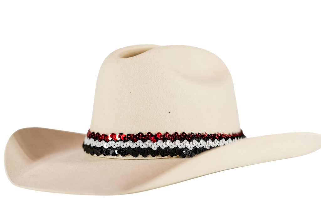 A light beige cowboy hat featuring a decorative band of red, white, and black sequins around the crown, shown against a plain white background.