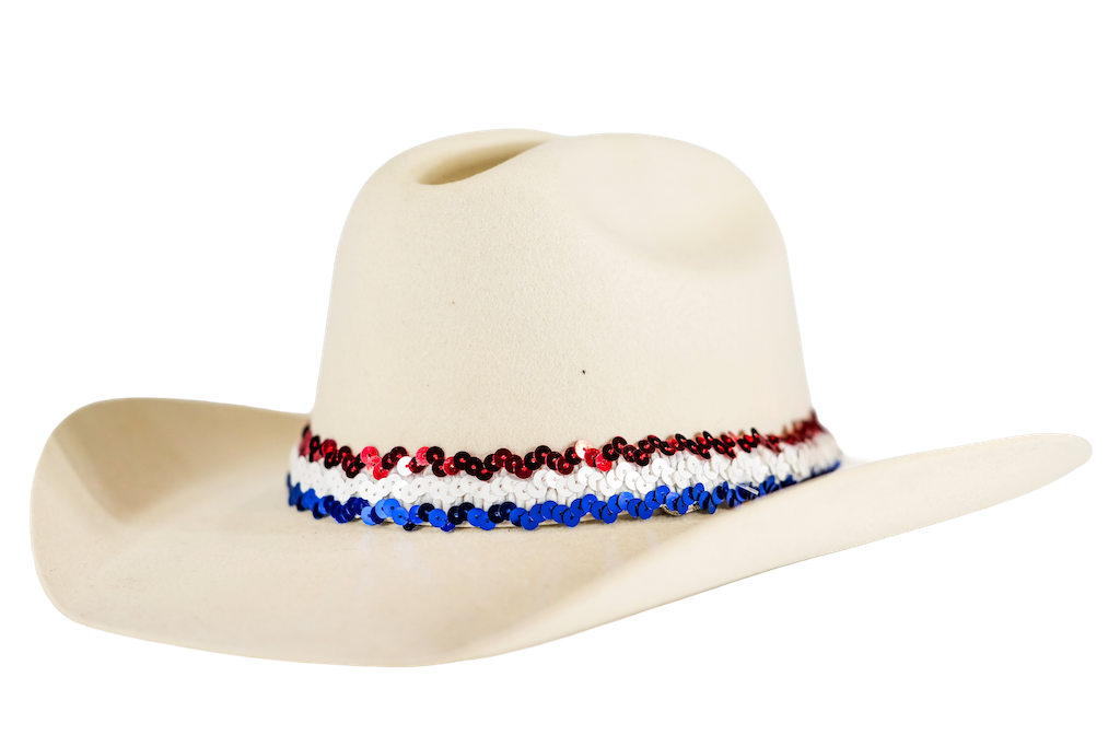 An off-white cowboy hat featuring a decorative band around the crown with red, white, and blue sequins, set against a plain white background.
