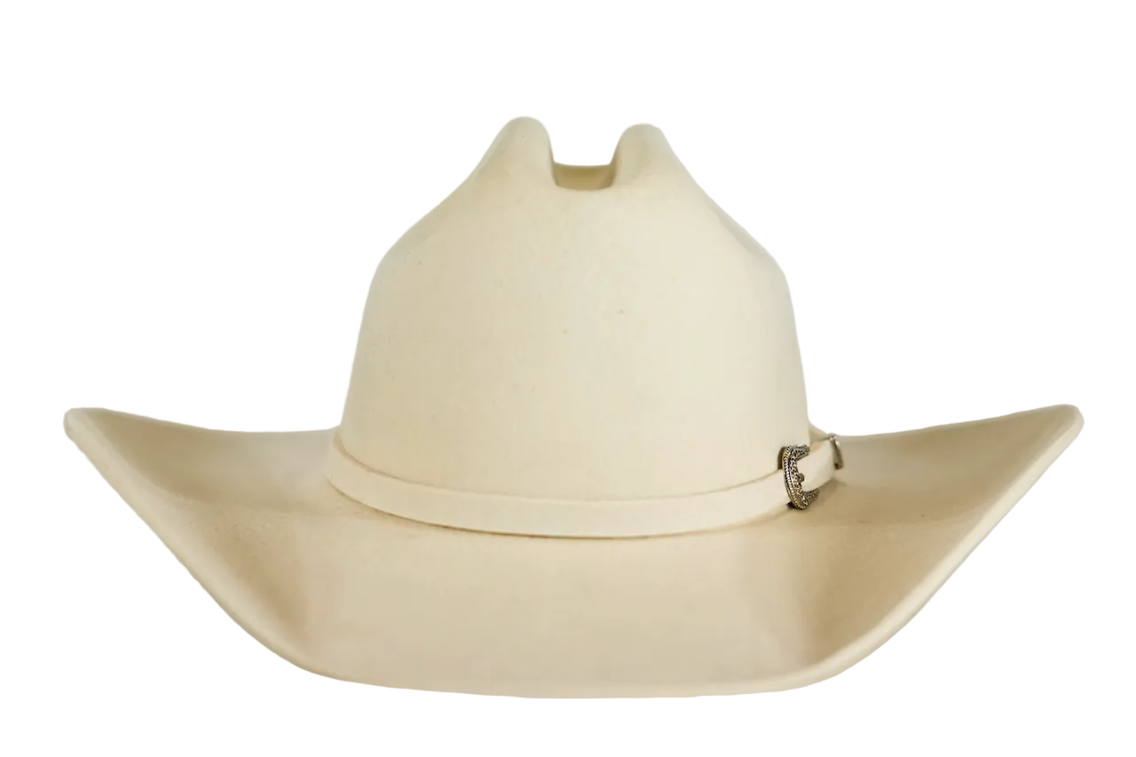 An off-white cowboy hat with a small silver decorative buckle on the side, displayed against a plain light gray background.