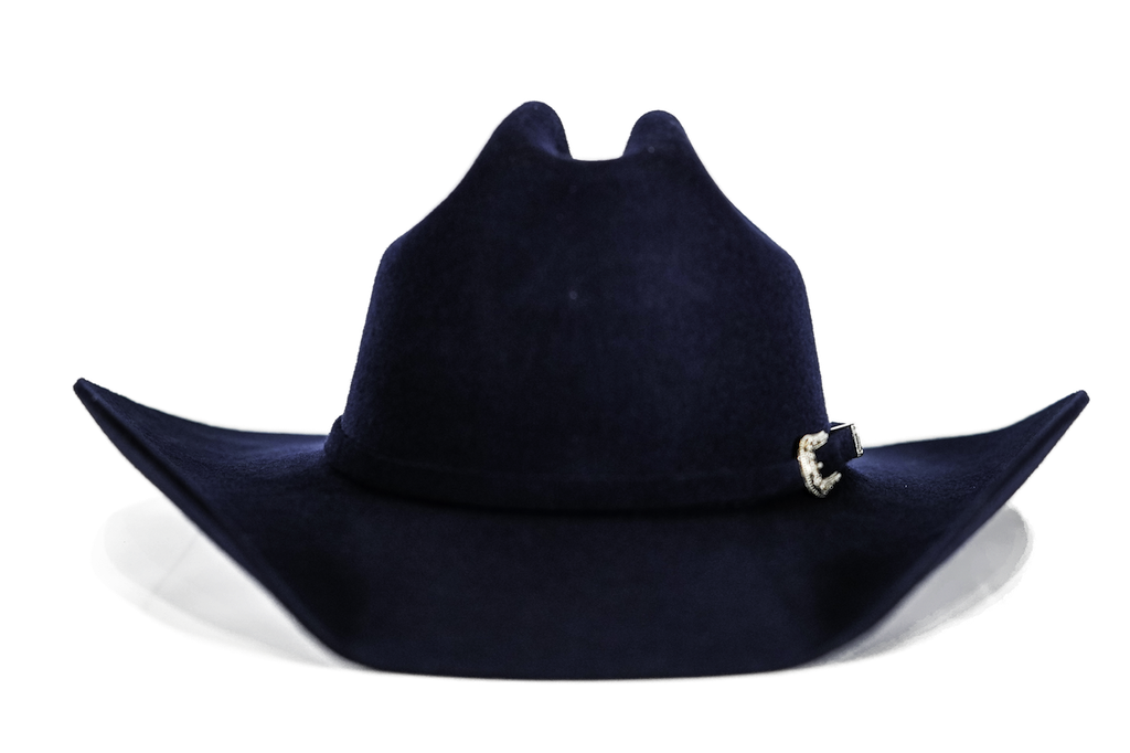 A dark navy blue felt cowboy hat with a small silver decorative buckle on the side, shown against a plain white background.